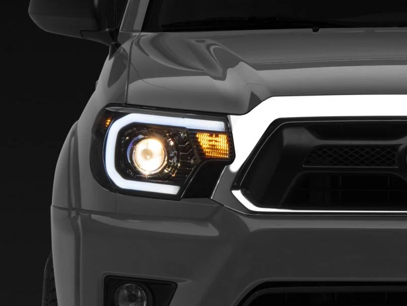 Raxiom Axial Series Projector Headlights with LED Bar; Black Housing; Clear Lens (12-15 Tacoma) Item TT21849
